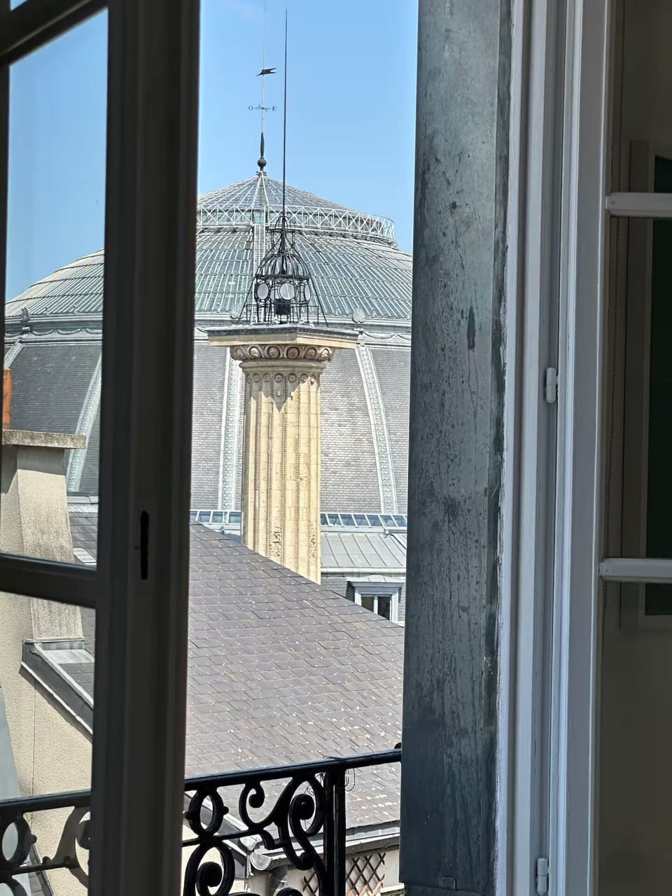 Loft windows face the Pinault Collection in the historic Bourse de Commerce