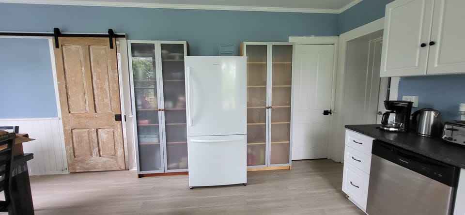 Kitchen with appliances and barn door