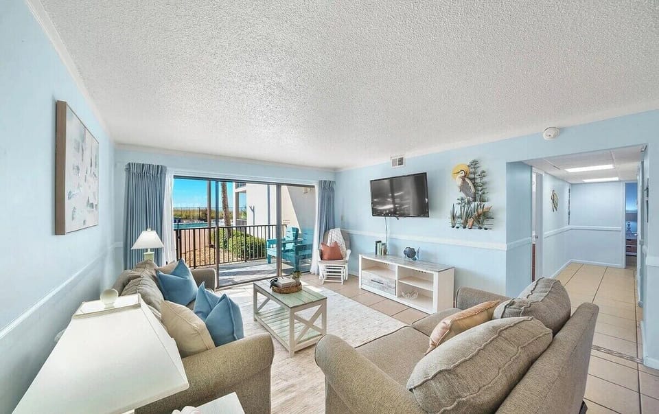 Open concept living area with stylish furnishings