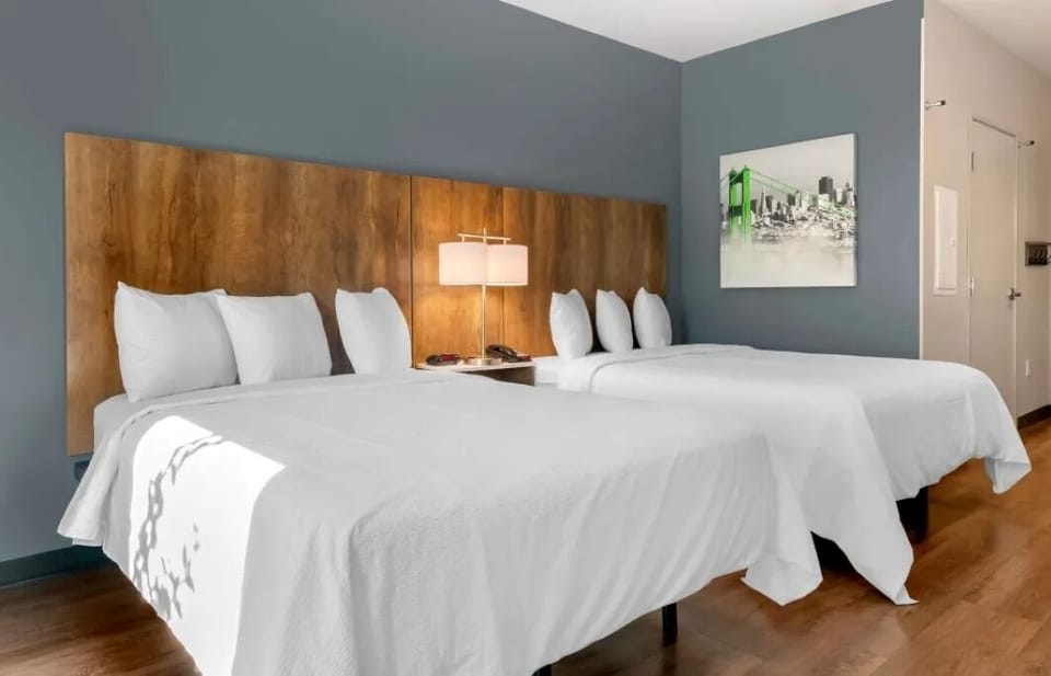 Get ready comfortably with a wide vanity and bright mirror.