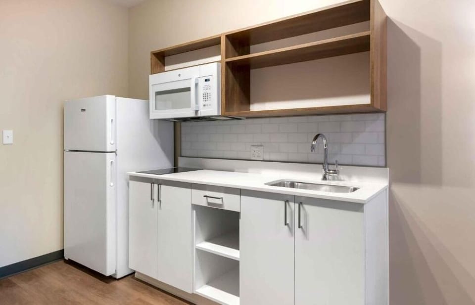 Cook simple meals easily with clean counters and modern sink.