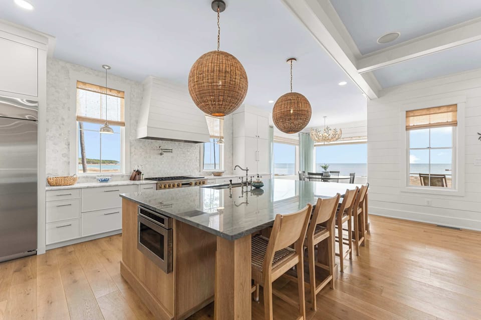 With panoramic views and a design that blends simplicity and sophistication, this stunning kitchen is built for connection. From morning coffee at the island to evening gatherings overlooking the bay, every meal becomes a celebration.