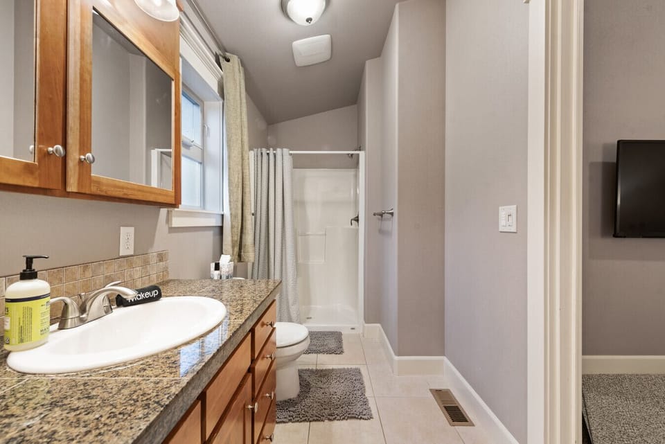 Master bathroom with a walk-in shower