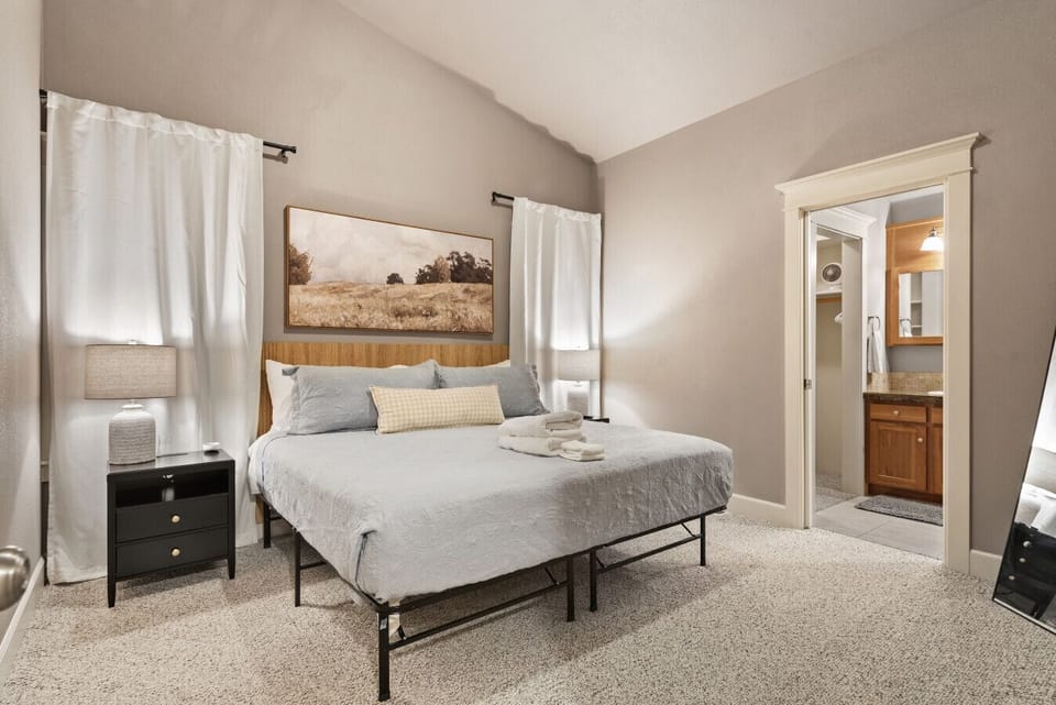 Beautiful master bedroom with a king-size bed and black-out shades!