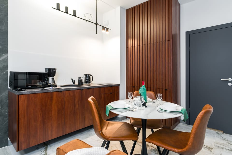 Large table with chairs for eating communal meals. 