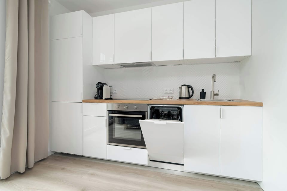 Kitchenette with oven and dishwasher.
