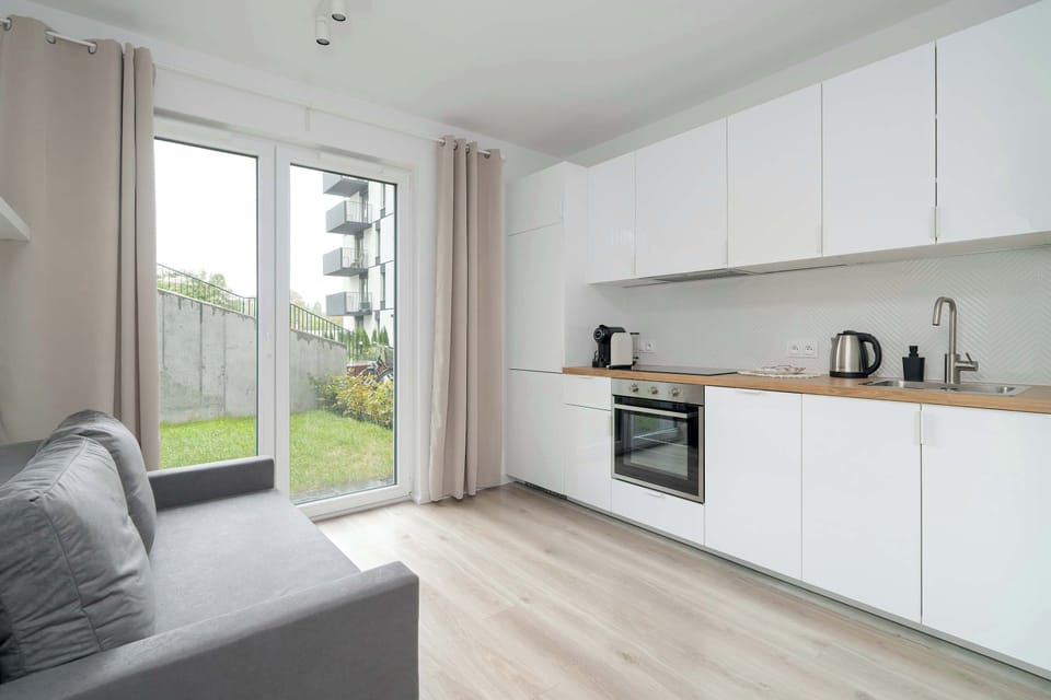 Stylish living room with kitchenette.