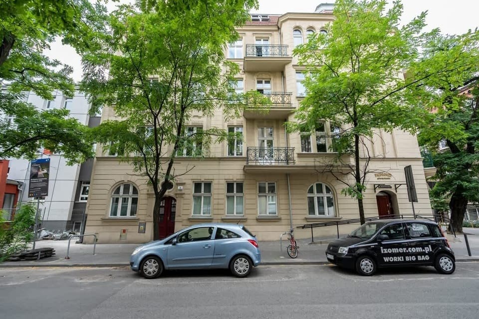 Exterior view of the historic building situated in a leafy and peaceful neighborhood.

