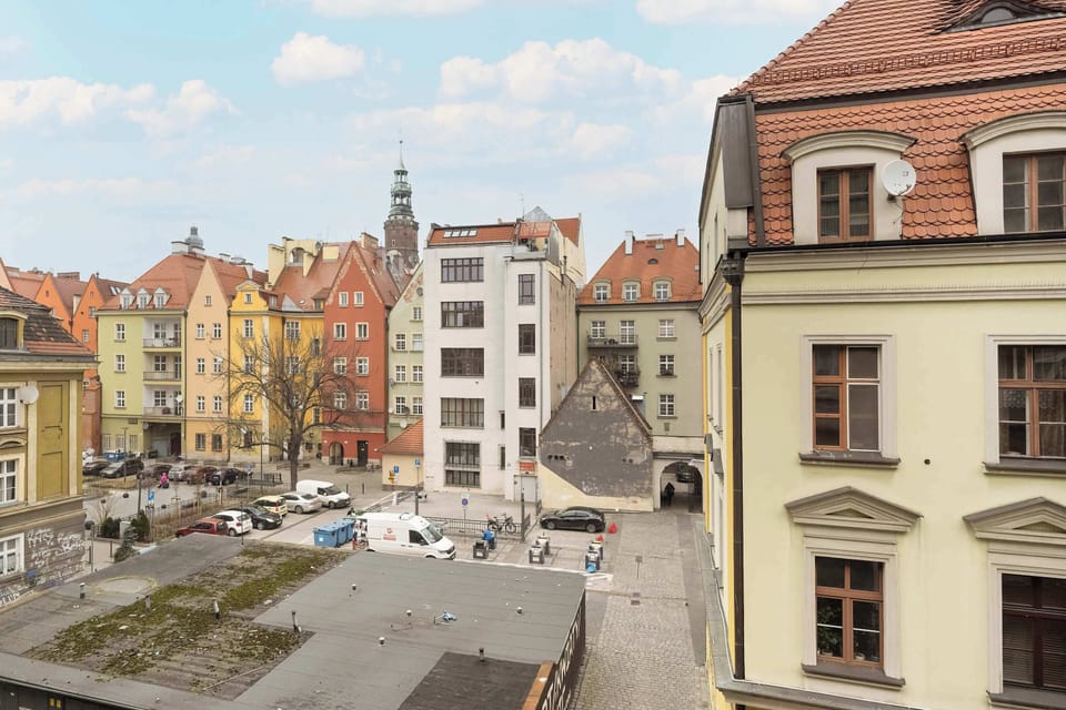 A stunning cityscape with historic buildings and a charming cobblestone street, capturing the essence of the neighborhood.