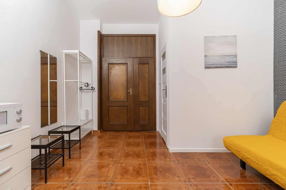 The living area's traditional decor creates a welcoming atmosphere. 