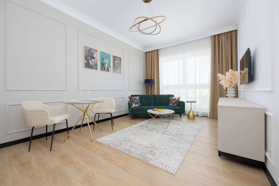 A view of the spacious living room with a comfortable sofa bed.