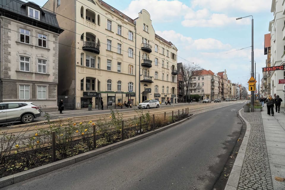 Another angle of the street, highlighting the vibrant urban surroundings and accessible location.