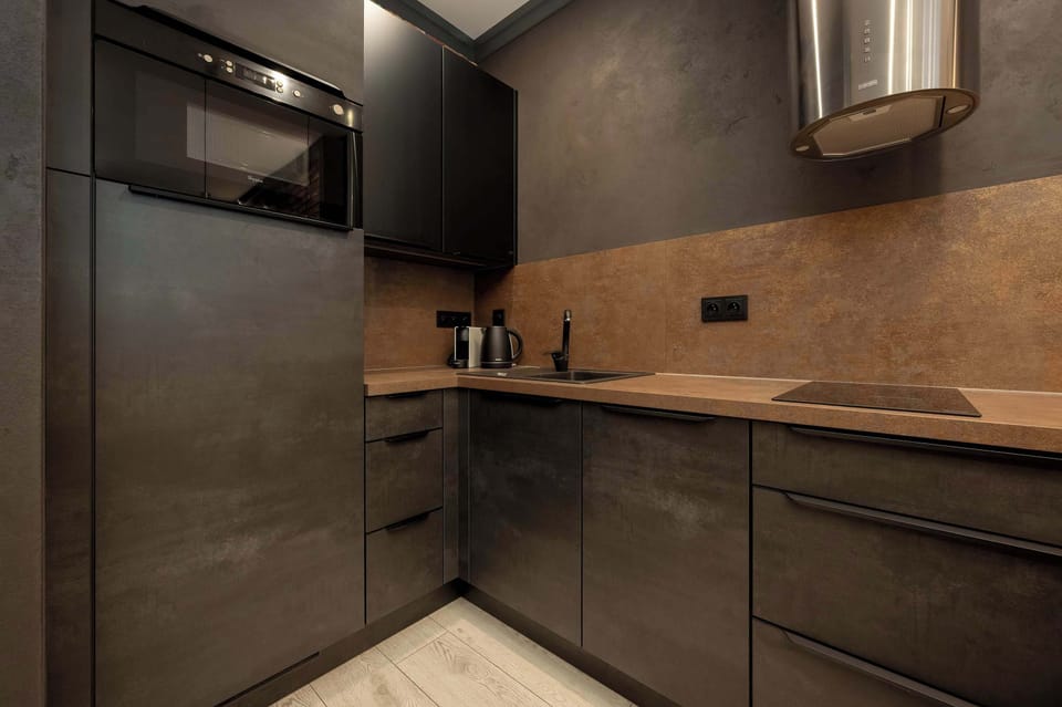 The thoughtfully designed kitchenette offers ample cooking space without compromising on style.