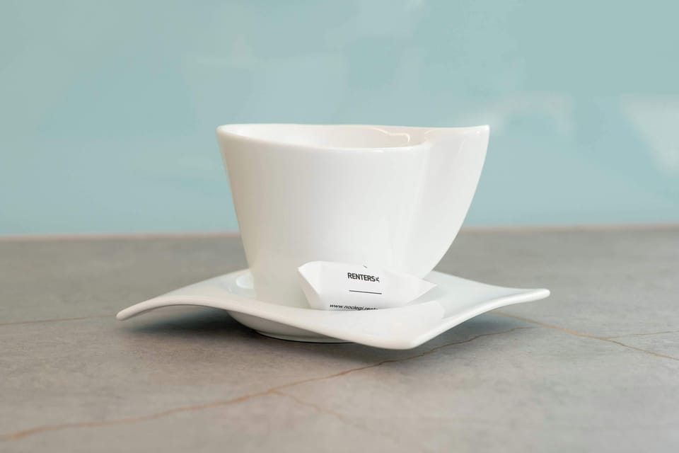 A close-up of a white coffee cup.