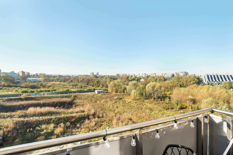 Balcony with a nice view of the surrounding, green areas.