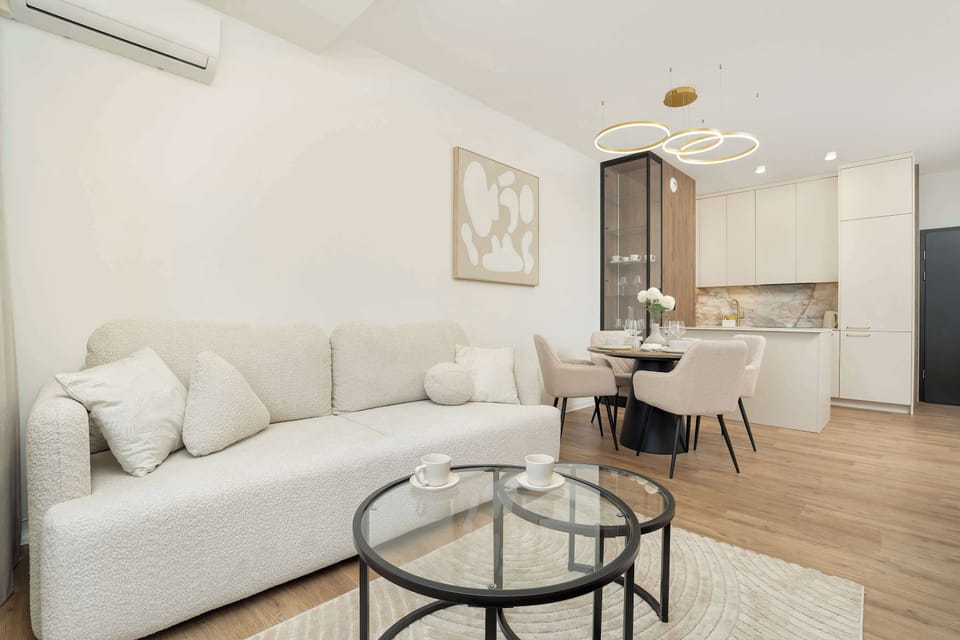 Spacious, air conditioned living room with kitchenette, cable television and double sofa bed.