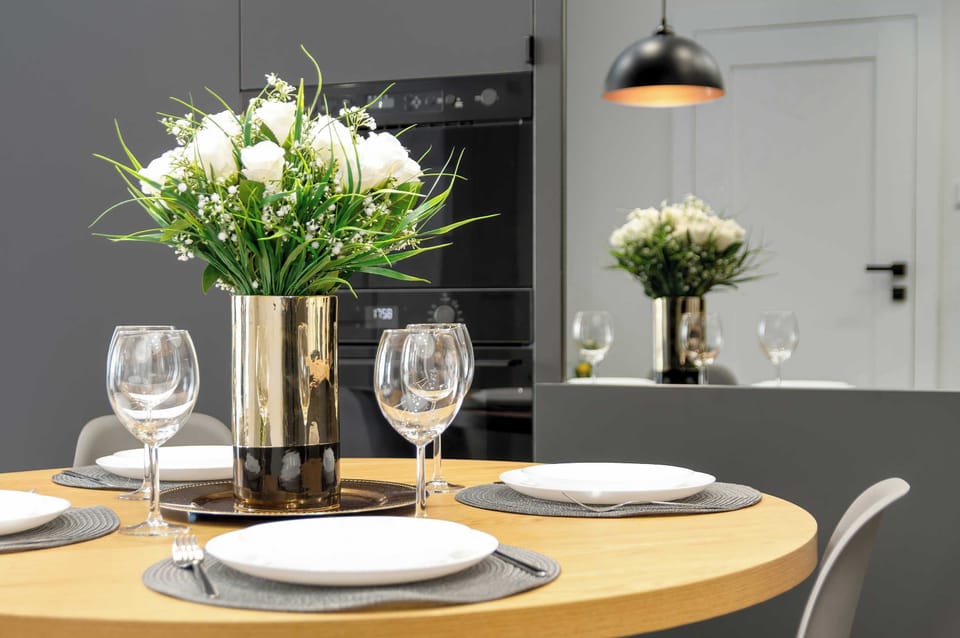 Dining table with tableware.
