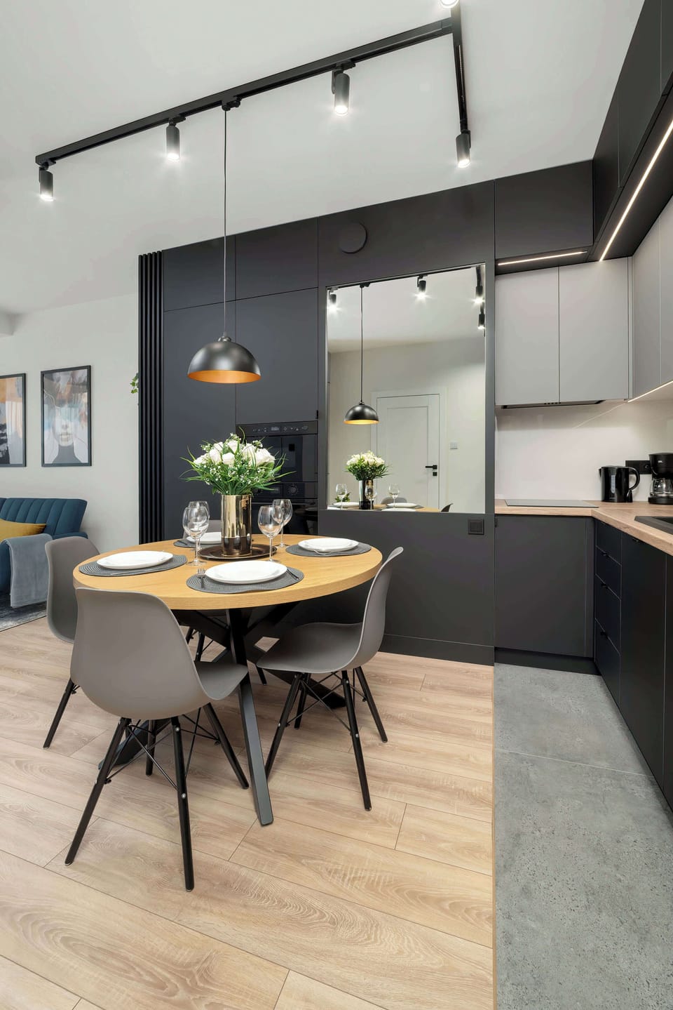 Kitchenette with induction cooktop, oven, microwave, refrigerator with freezer, electric kettle, coffee maker (pour-over), toaster, dishwasher and dining area.