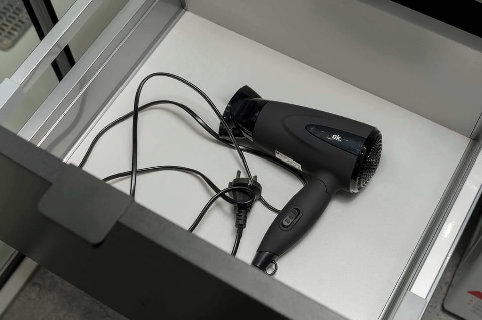 Hair dryer in the bathroom.