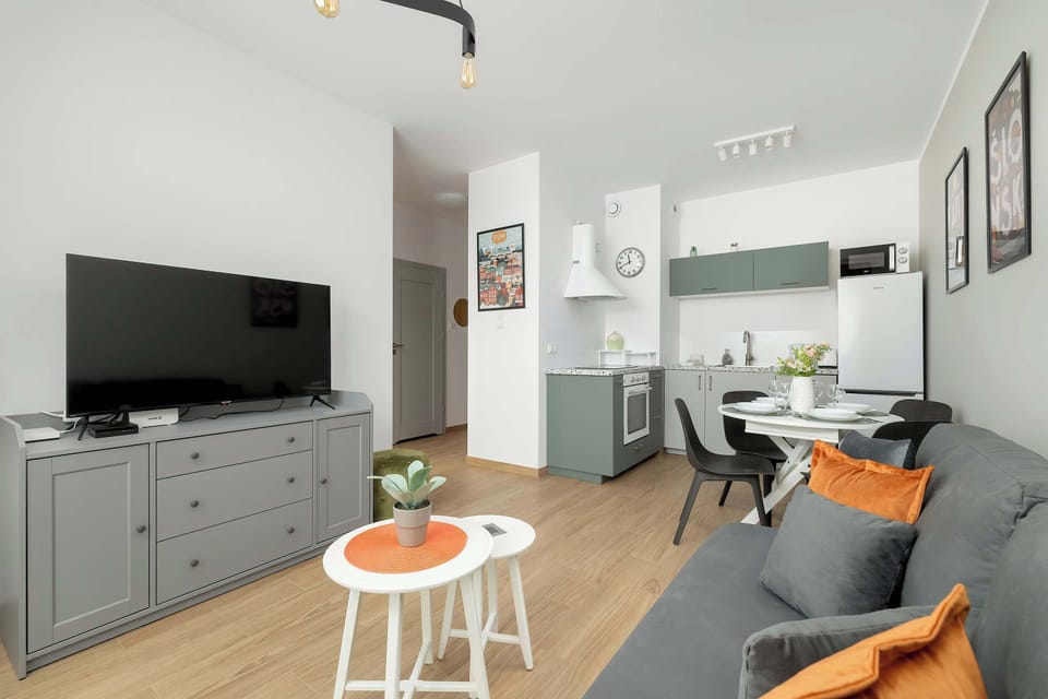 A perspective showcasing the seamless transition between the dining and living spaces, emphasizing openness.