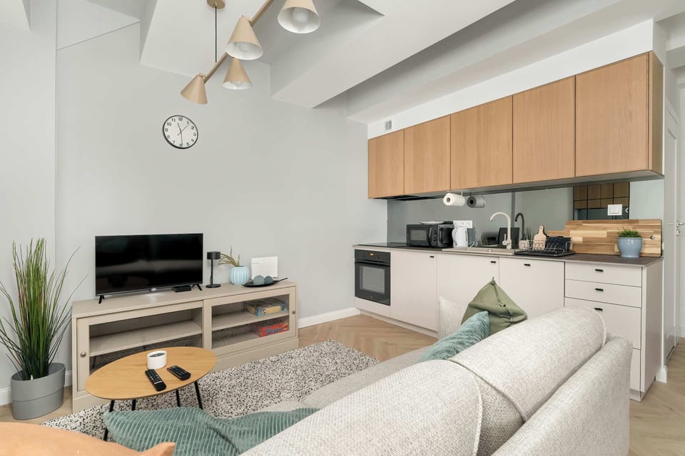 The sleek design of the kitchenette blending seamlessly with the living area.