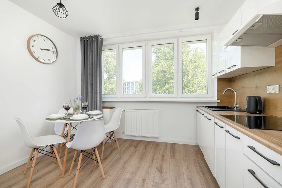 The sleek design of the kitchenette blending seamlessly with the living area.