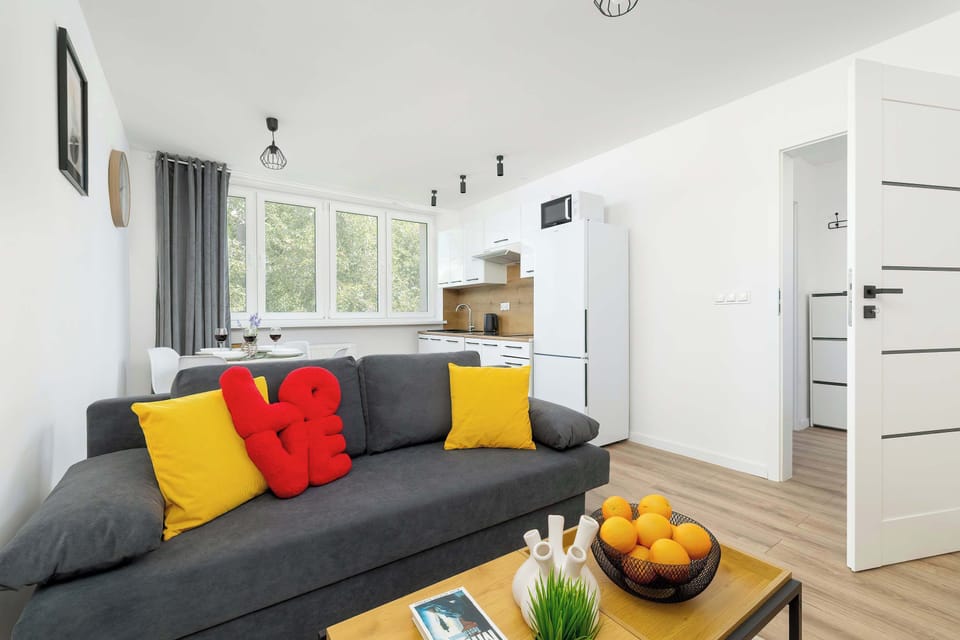 Relax in the stylish living room with a comfortable sofa and modern decor.