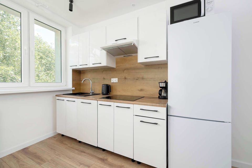 The fully equipped kitchenette includes everything you need for a home-cooked meal.