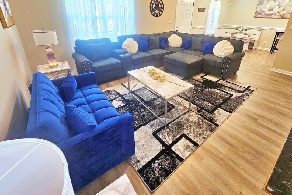 Kick back, relax in this comfy living room, and watch your favorite movie or show on the 50-inch flat-screen smart TV. The blue sofa is a pull-out sofa bed!