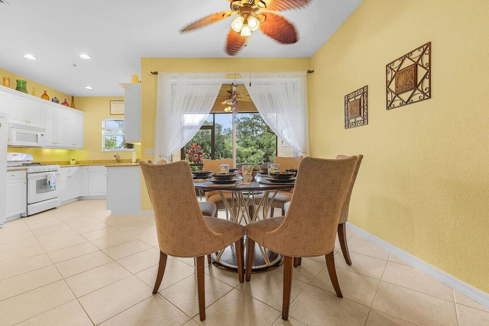 Dining for six with an open concept dining and kitchen area