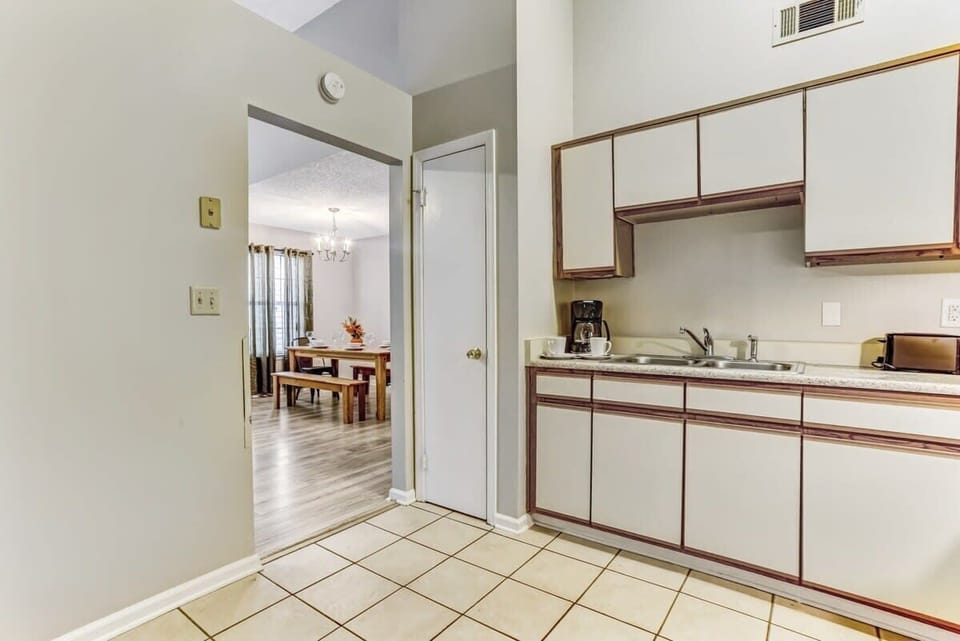 Another view of the kitchen showing the range and counter space.