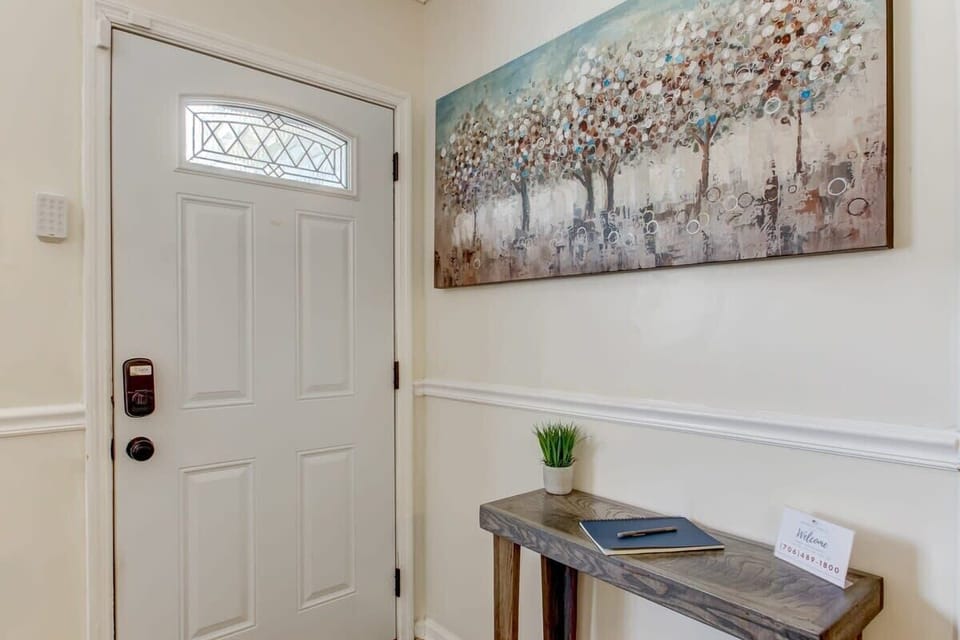 Clean and welcoming entryway with organized entry space.
