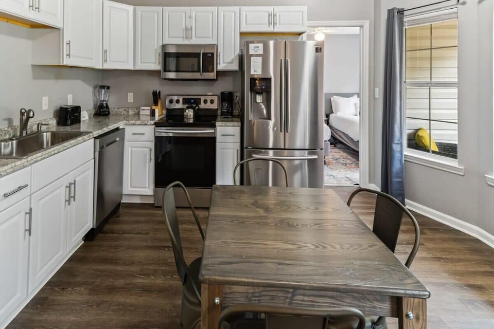 Bright white kitchen with modern appliances and everything you need to cook with ease.