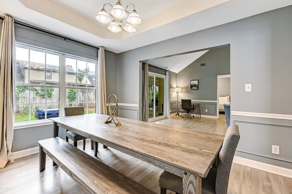 Spacious dining table with room for everyone to gather and share meals.