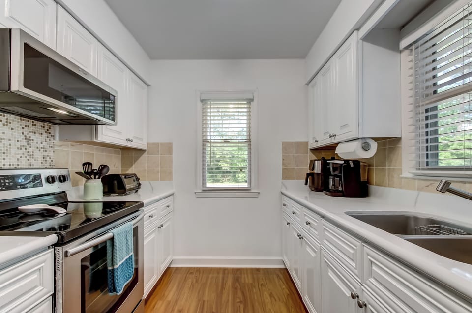 Another angle of the efficient kitchen layout. Everything you need is within easy reach.