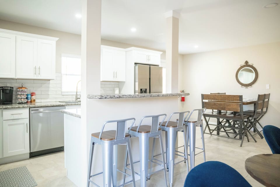 Full kitchen with island seating and dining table 