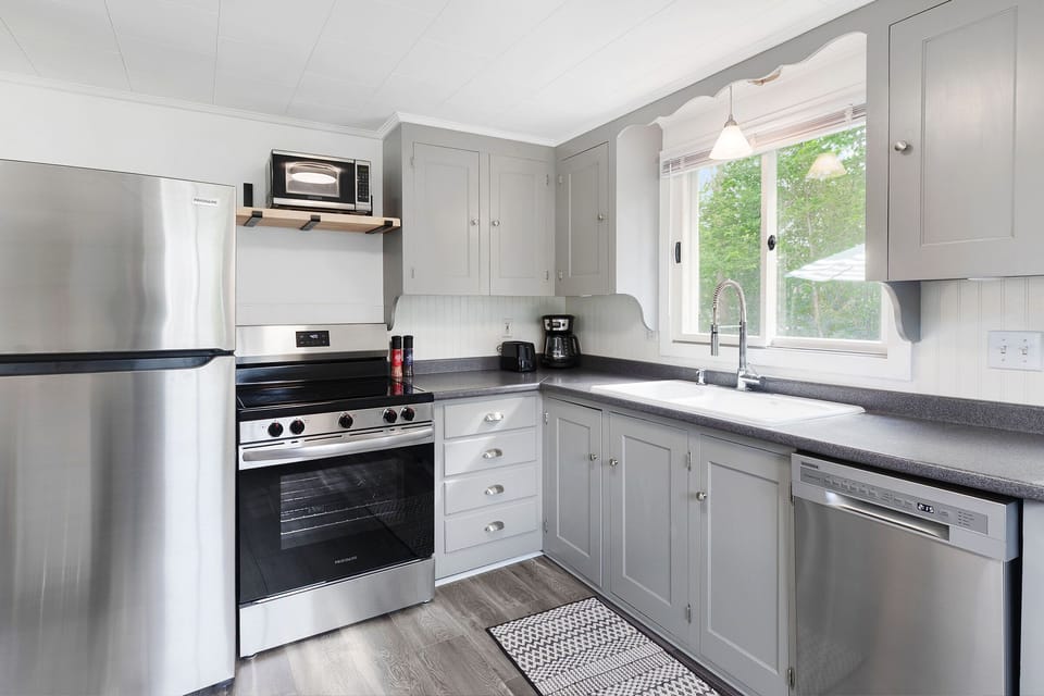 The fully-stocked kitchen comes with new appliances and updated floors.