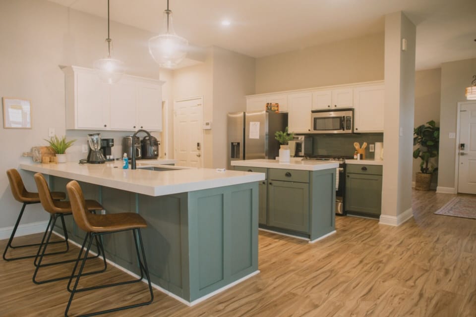Our modern, fully equipped kitchen is ready for all your culinary adventures. Featuring a spacious island and sleek appliances, it’s designed for both convenience and style—just a short drive from Adriatica Village.