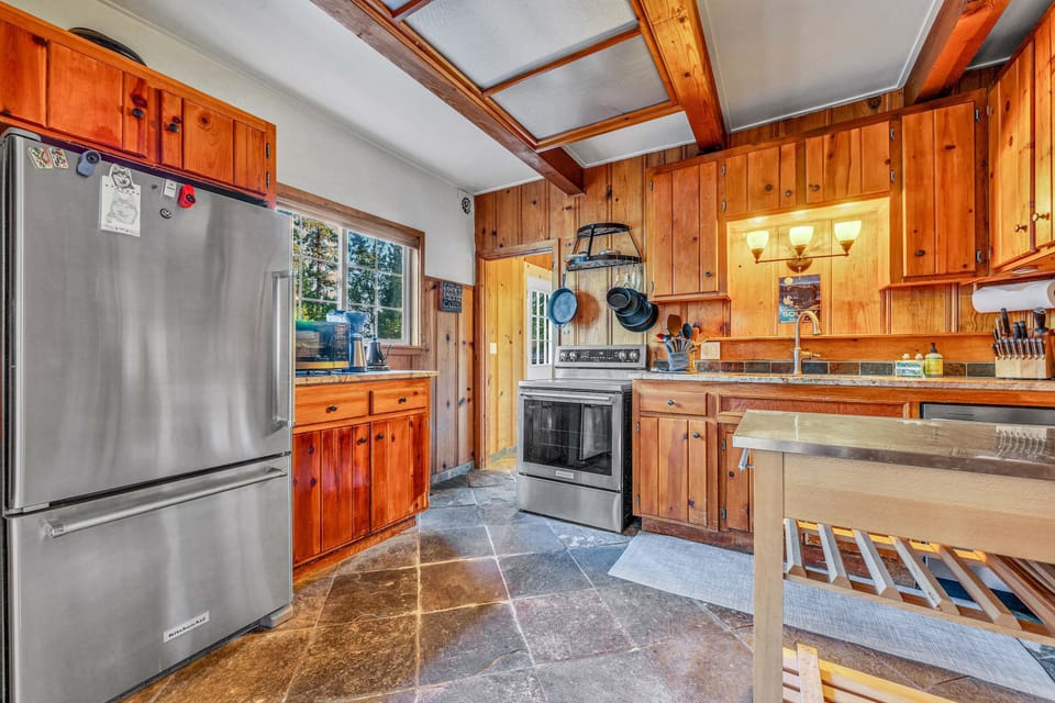 Kitchen: Drip coffee maker, Crockpot, air fryer, waffle maker, cooking utensils, tableware