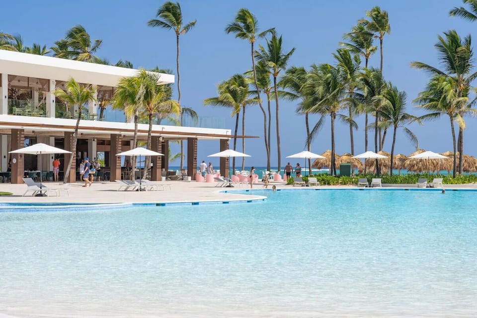 Dive into turquoise waters with palm-framed ocean breezes.