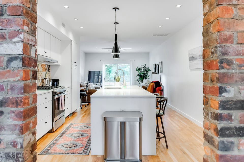 Kitchen: Bright and modern space with stylish seating for your culinary creations!