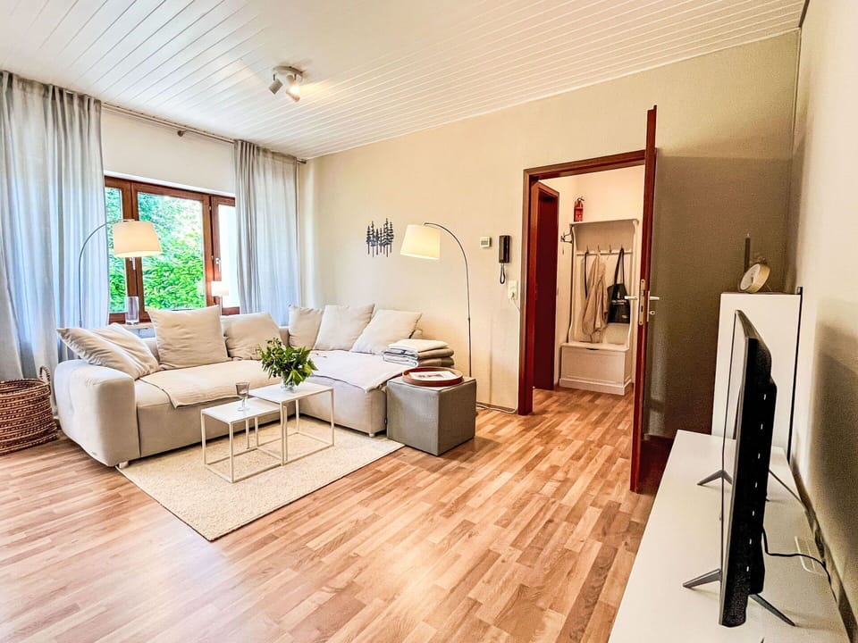 Furniture, Interior Design, Floor, Flooring, Couch, Wood Flooring, Wall, Wood, Living Room, Room