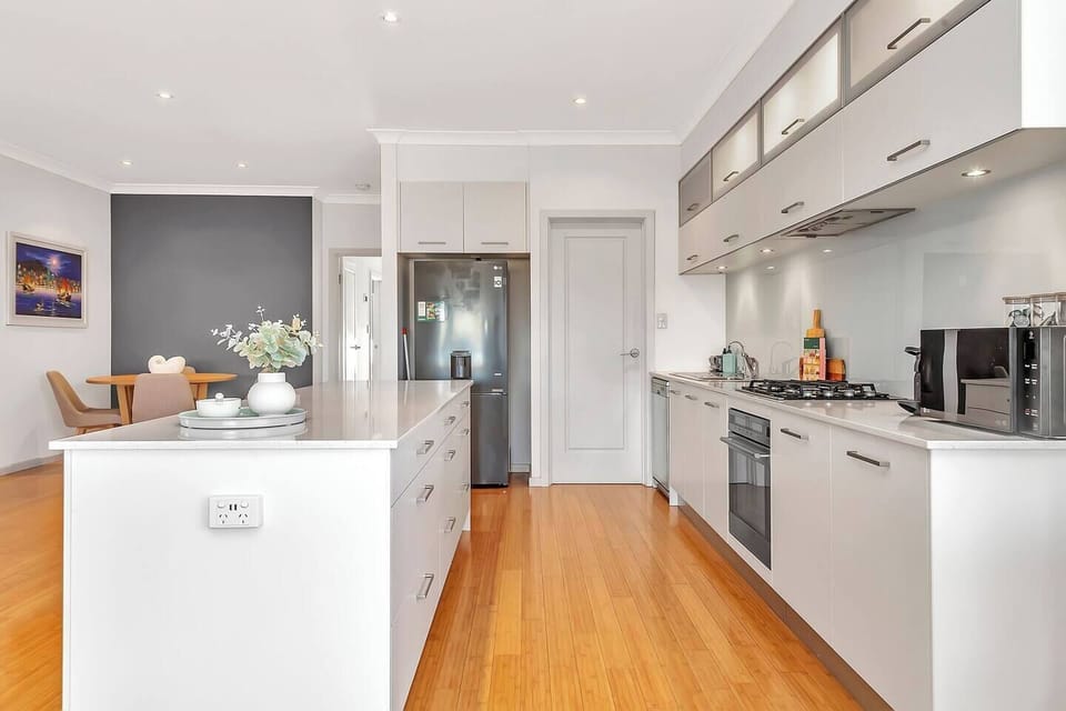 Prepare meals in the fully stocked kitchen, complete with a fridge, gas cooktop, espresso machine, microwave and dishwasher, ideal for everything from easy breakfasts to gourmet dinners.