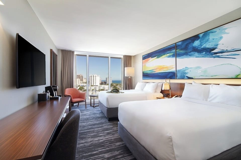 Spread out comfortably in two plush beds with skyline views.