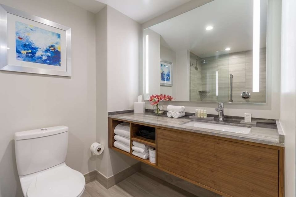 Refresh in a bright, modern bath with generous vanity space.