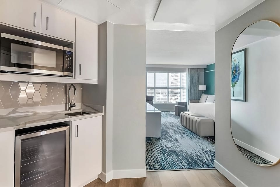 Fix snacks and drinks easily in your sleek kitchenette.