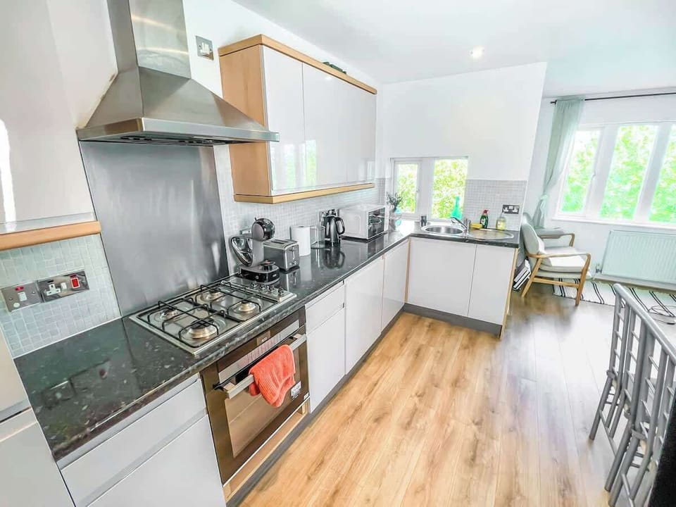 A fully equipped cooking space with modern appliances, ample storage, and countertops for meal preparation.