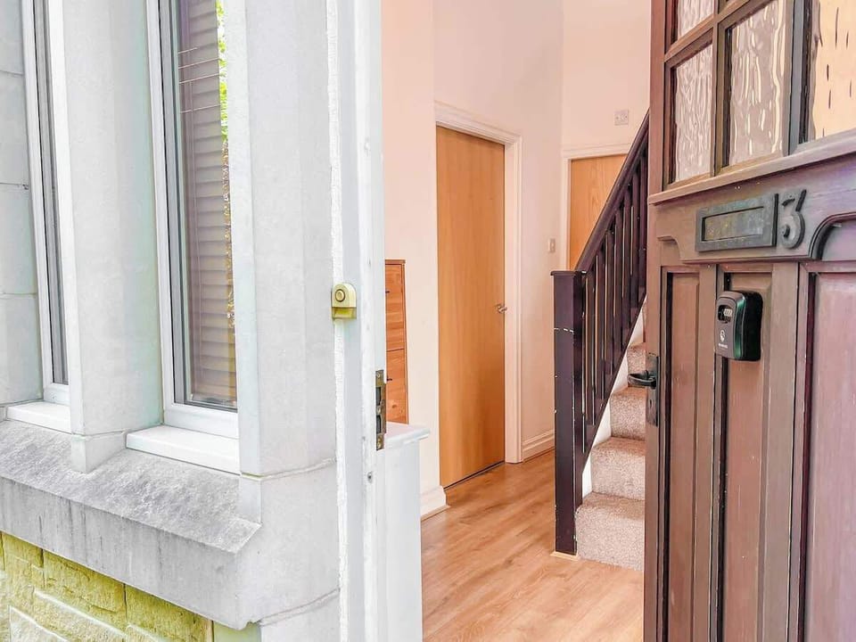 This charming exterior showcases the inviting entrance and well-maintained surroundings of the property. Featuring modern architecture blended with timeless design.