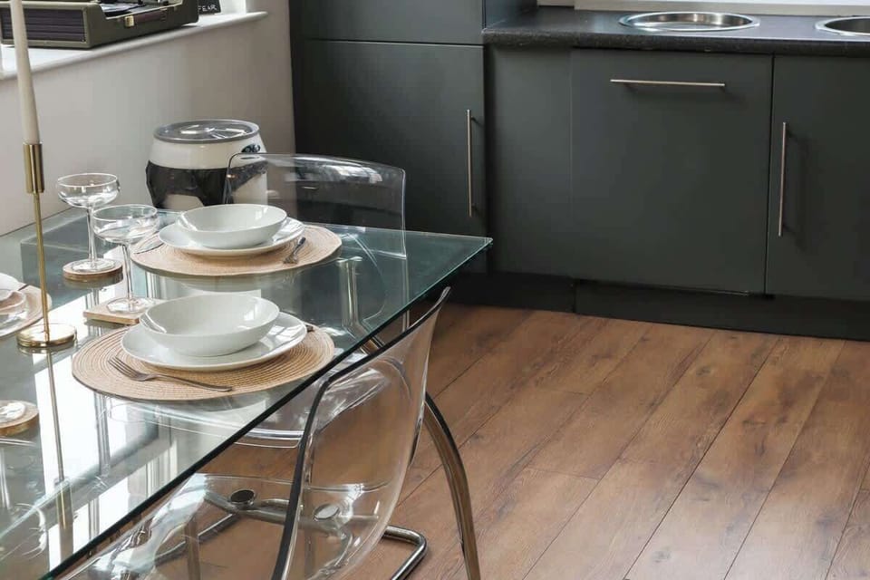 The dining area is a designated space for enjoying meals, typically furnished with a table and seating.