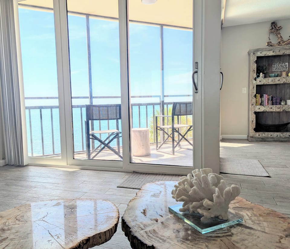 View of the balcony and bay from the sofa.